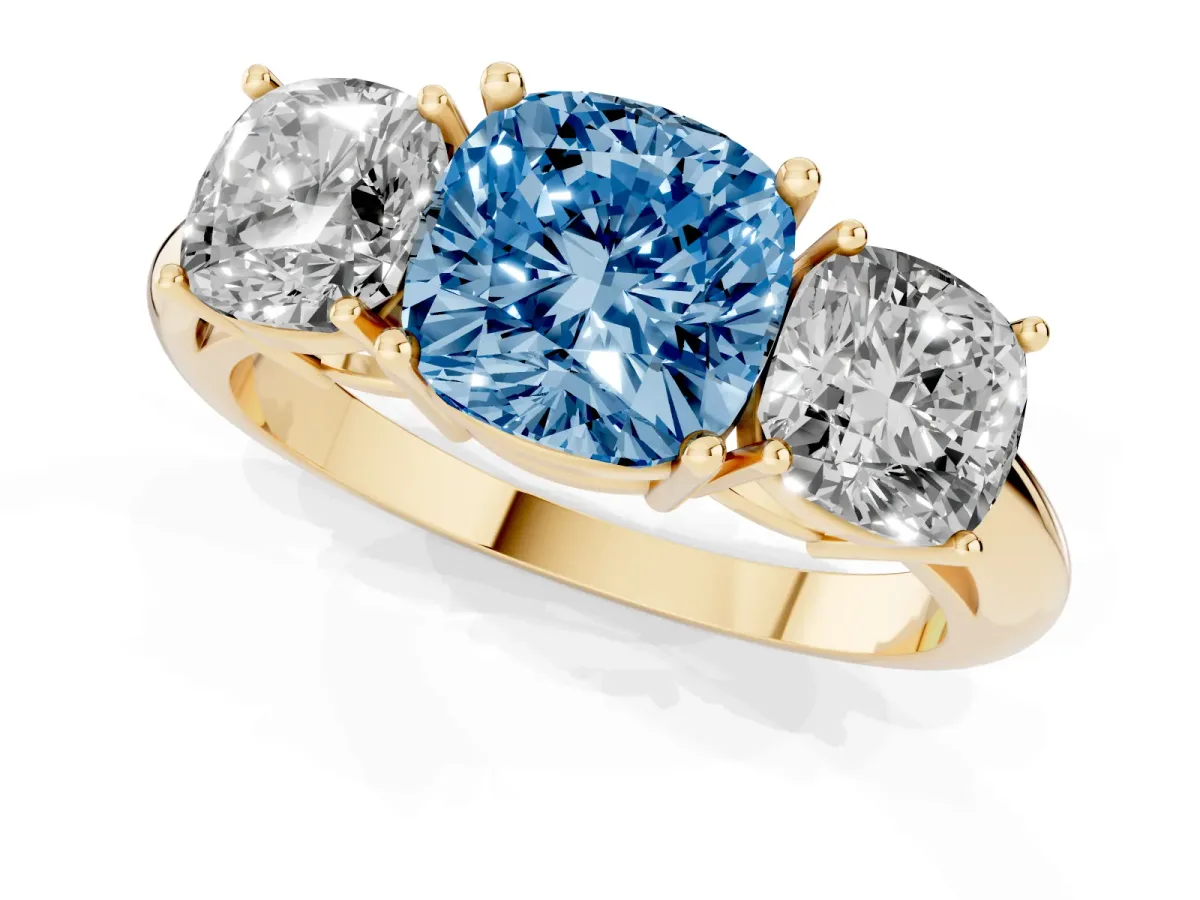 Fancy Blue Three-Stone Cushion Cut Cut Diamond Engagement Ring with Prong Setting on a White Gold Band Yellow gold