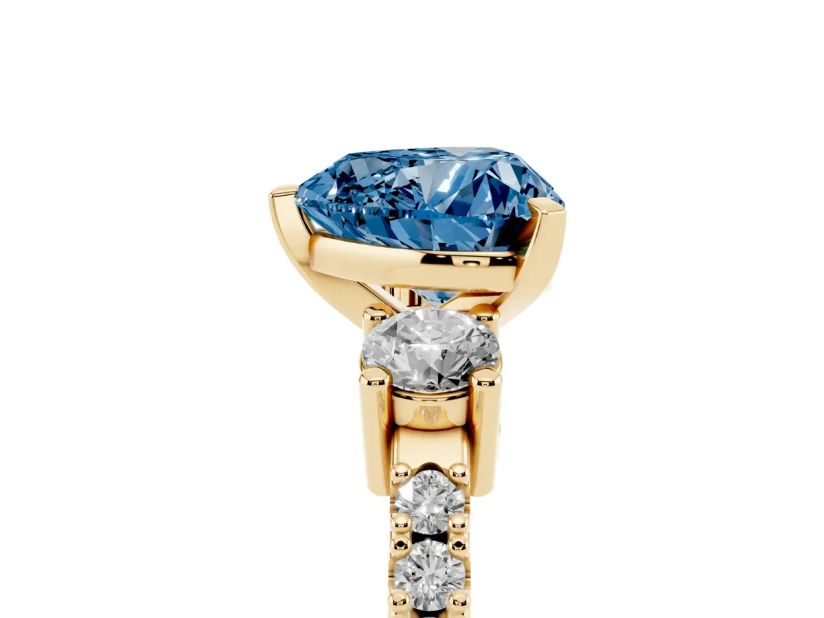 Fancy Blue Heart Cut Three-Stone Diamond Pavé Band with Prong Setting Yellow gold