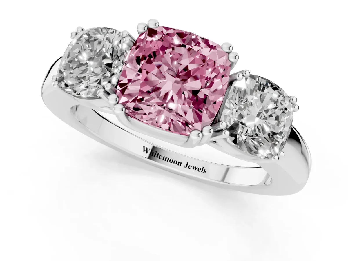 Fancy Pink Three-Stone Cushion Cut Cut Diamond Ring with Channel Set Band and Four-Prong Setting Platinum