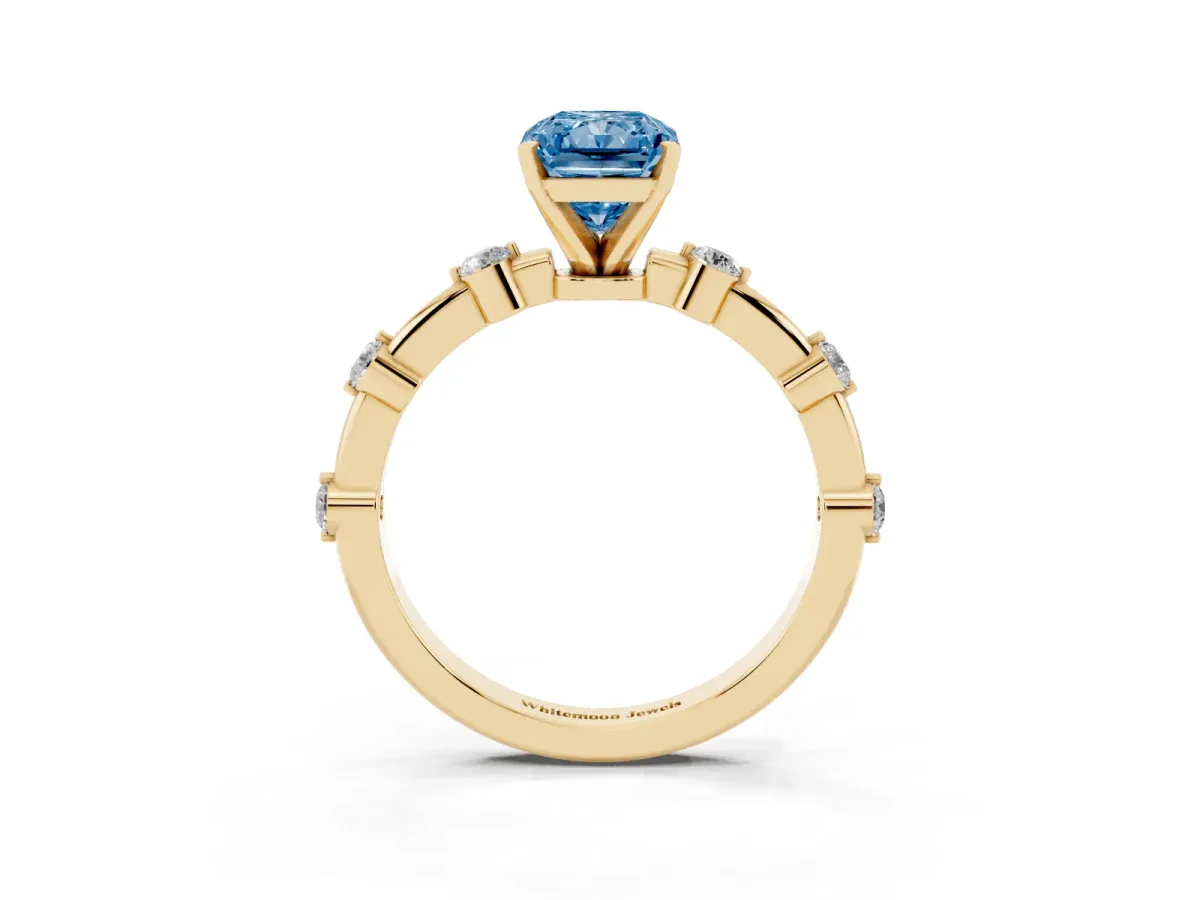 Fancy Blue Radiant Cut Solitaire Diamond Ring with Bezel Set Side Stones and Prong Setting Yellow gold
