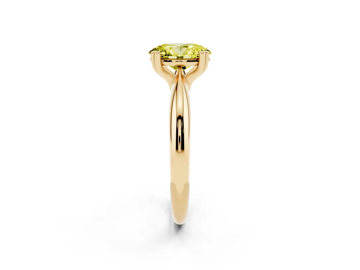 Fancy Yellow Oval Cut Cut Solitaire Engagement Ring with Tapered Band and Four-Prong Setting Yellow gold