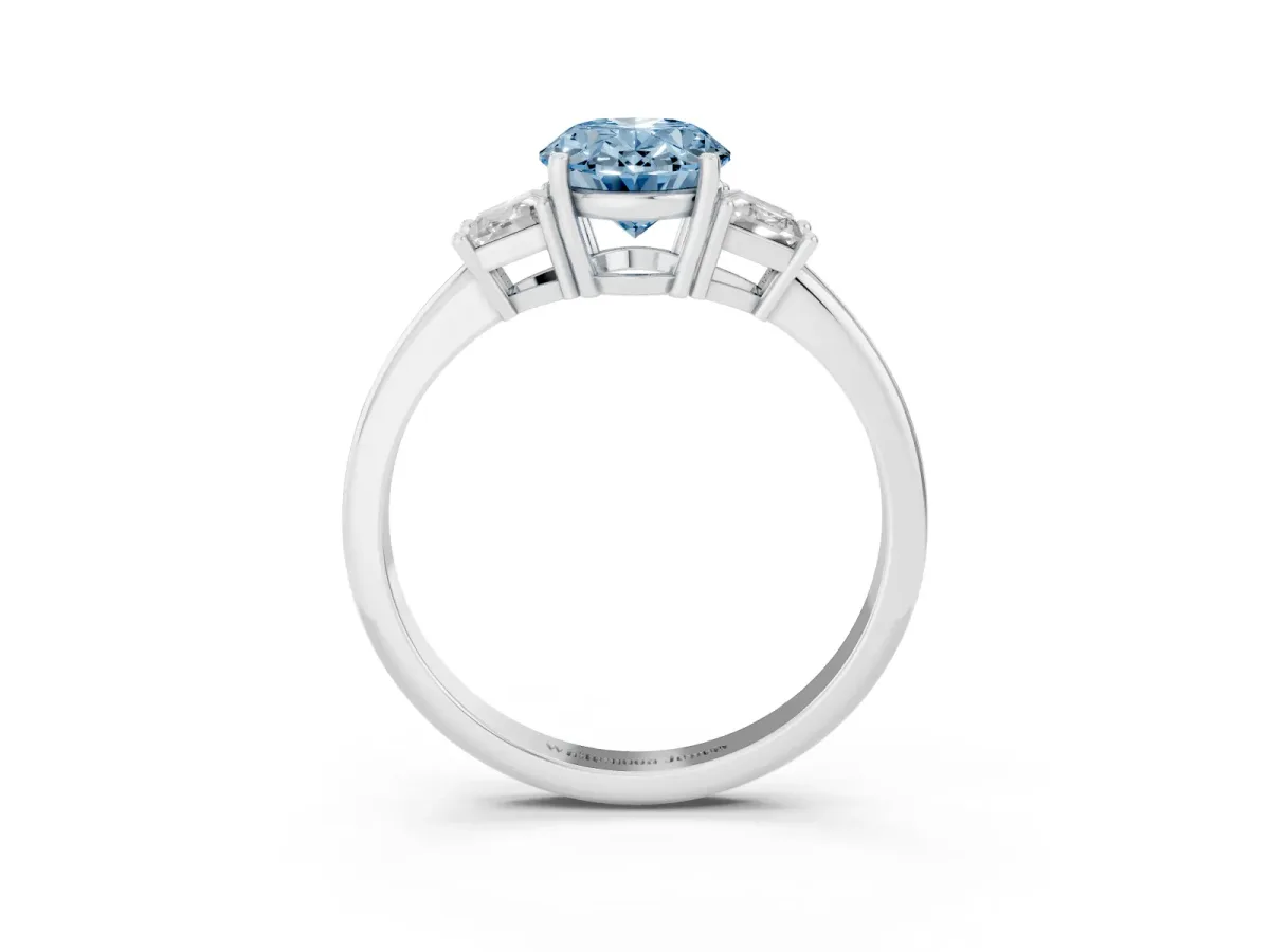 Fancy Blue Oval Cut Diamond Three-Stone Ring with Trapezoid Side Stones and Prong Setting Silver