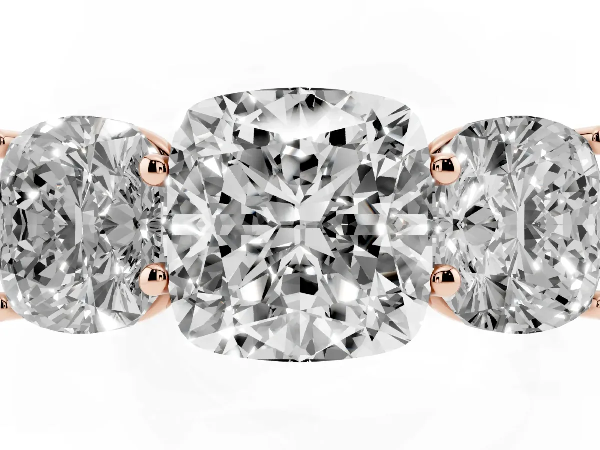 Cushion Cut Three-Stone Diamond Ring with Prong Setting on a Classic Band Rose gold