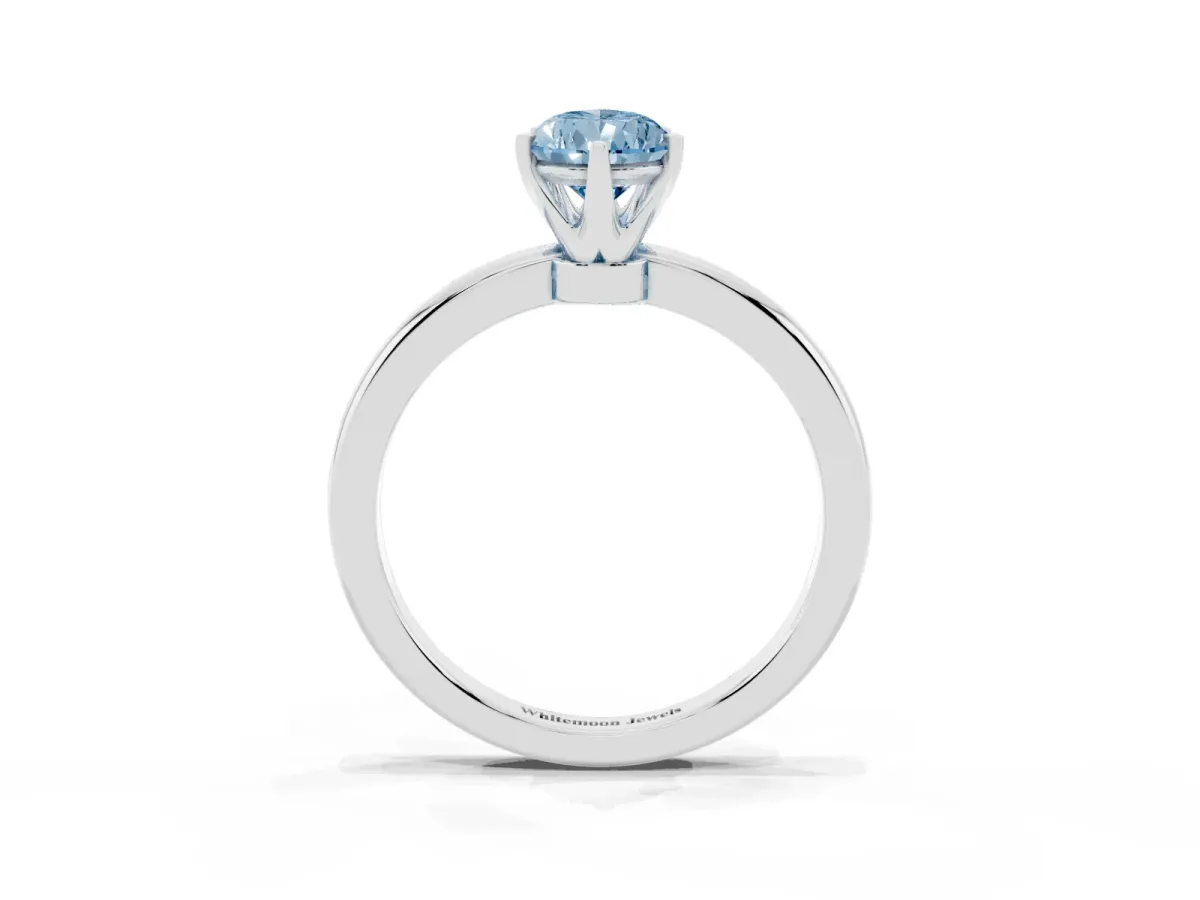 Fancy Blue Pear Cut Solitaire Diamond Ring with Six-Prong Setting on a Classic Band Platinum