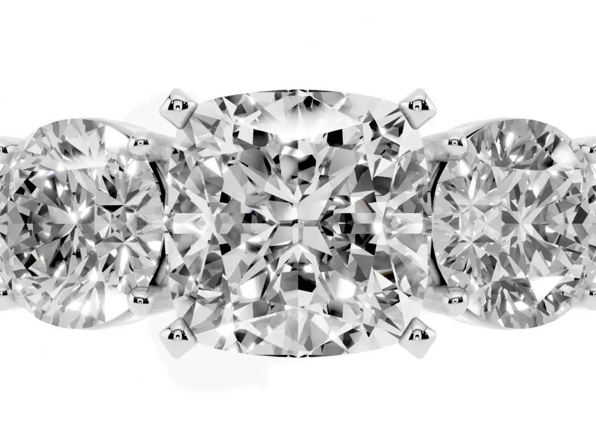 Three-Stone Cushion Cut Diamond Ring with Round Side Stones, Classic Band, and Four-Prong Setting Silver
