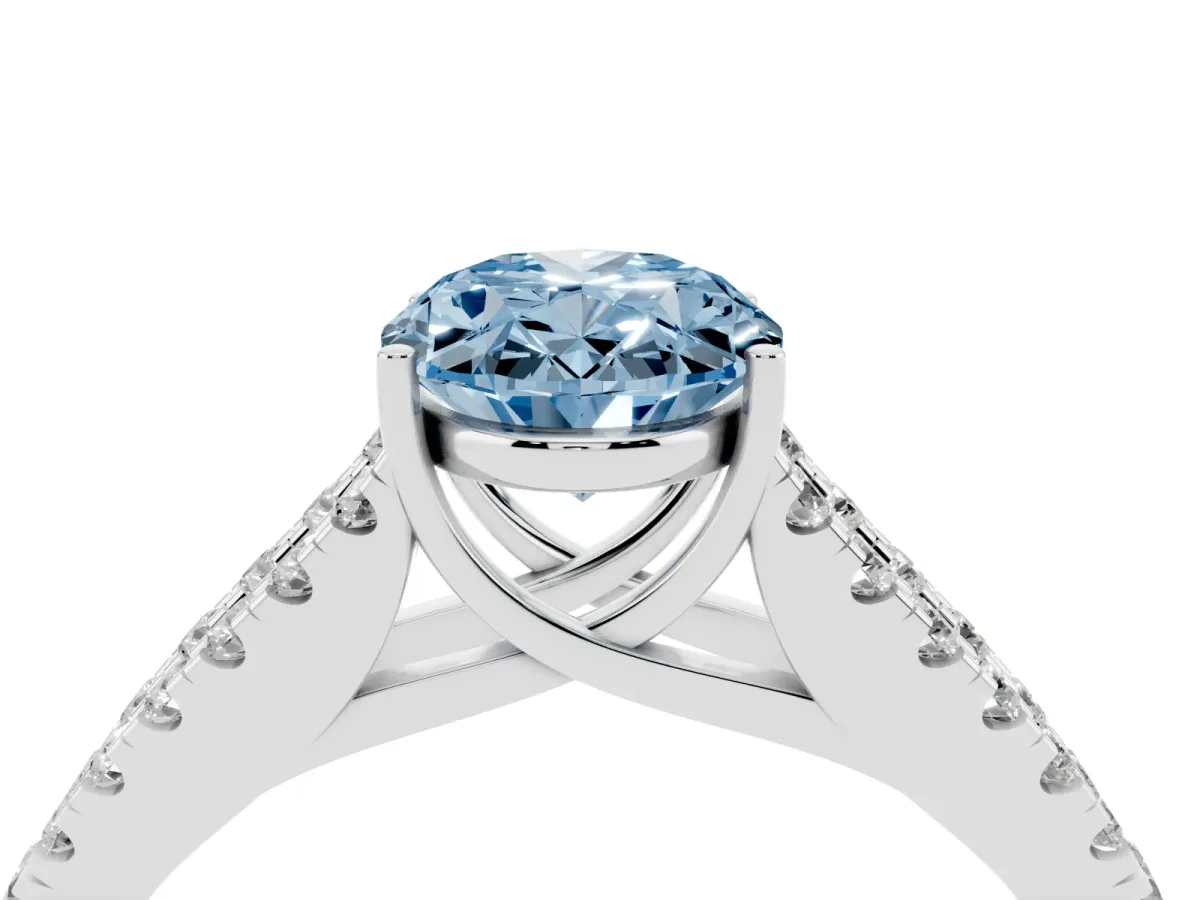 Fancy Blue Oval Cut Diamond Split Shank Pavé Engagement Ring with Four-Prong Setting Silver