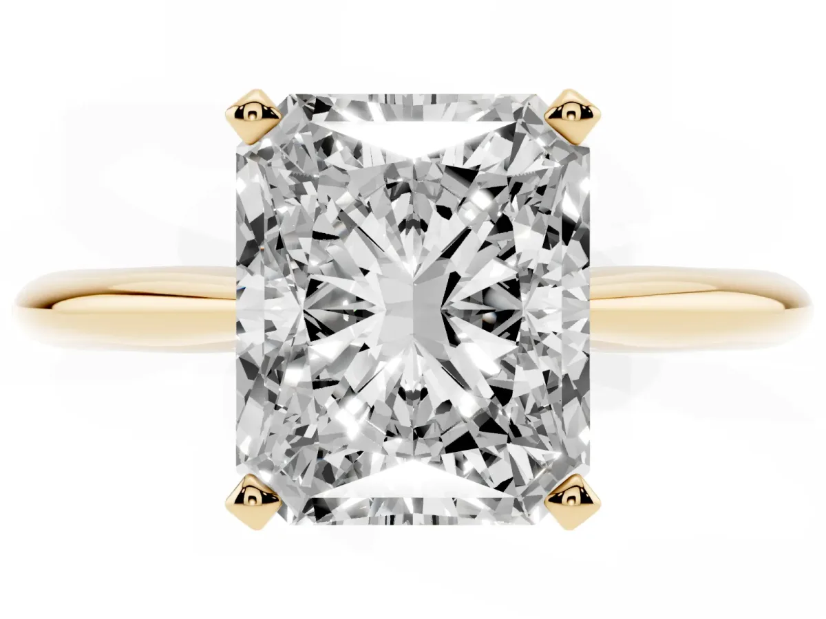 Radiant Cut Cut Solitaire Ring with Four-Prong Setting on a Classic Band Yellow gold