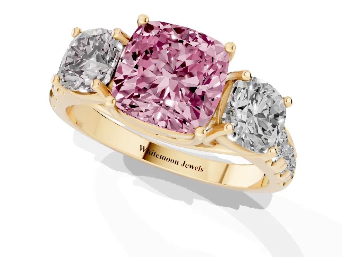 Fancy Pink Three-Stone Cushion Cut Diamond Pavé Band with Prong Setting Yellow gold