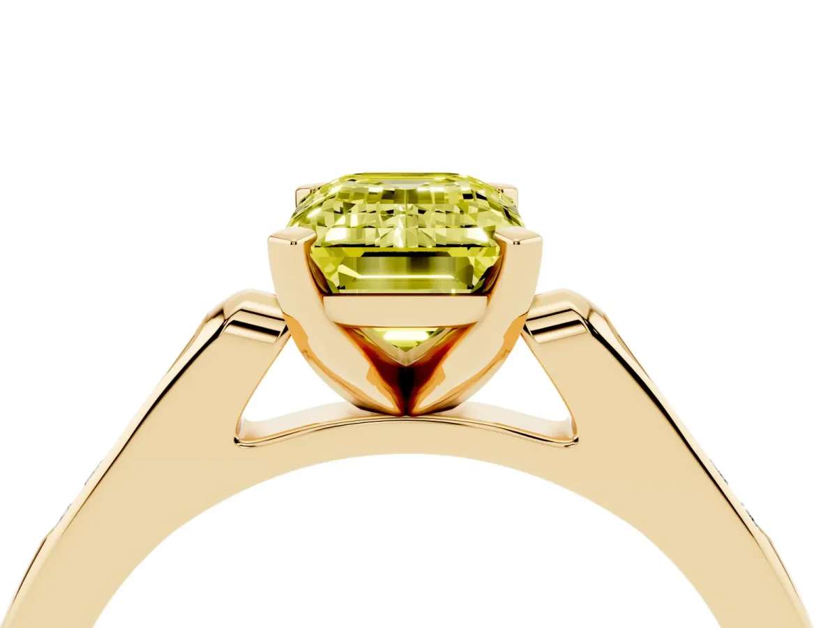 Fancy Yellow Emerald Cut Diamond Solitaire Ring with Channel Set Round Band and Prong Setting Yellow gold