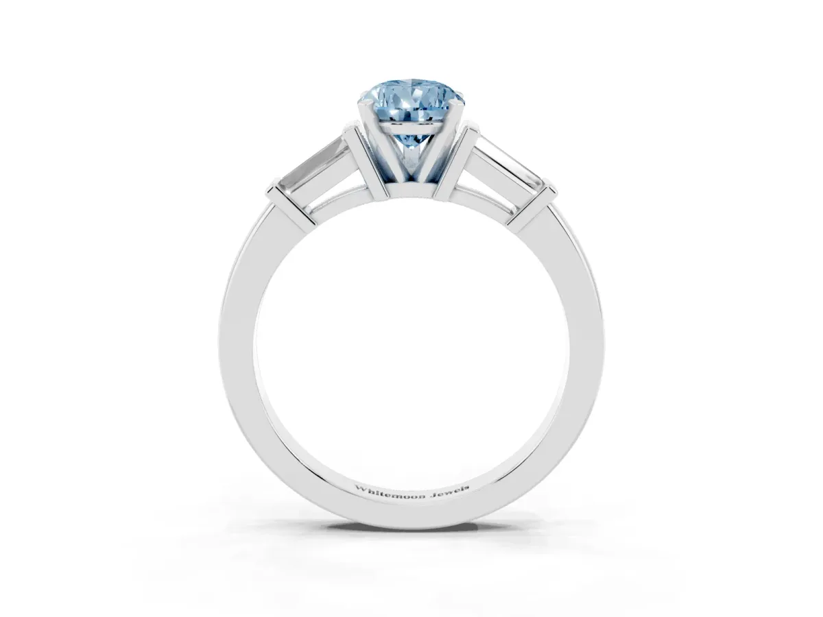 Fancy Blue Pear Cut Cut Diamond Solitaire Ring with Tapered Baguette Accents and Four-Prong Setting White gold