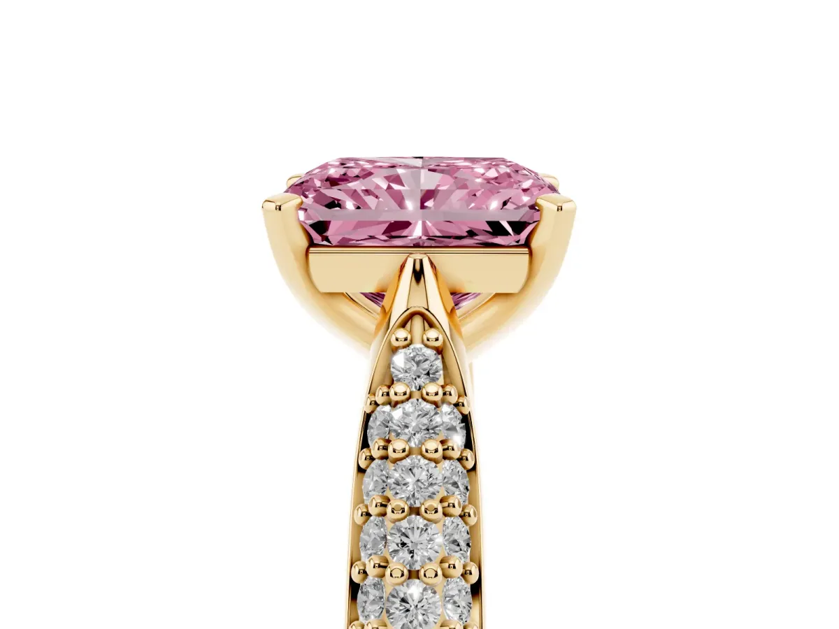 Fancy Pink Radiant Cut Diamond Solitaire Engagement Ring with Multi-Row Round Pavé Band and Prong Setting Yellow gold
