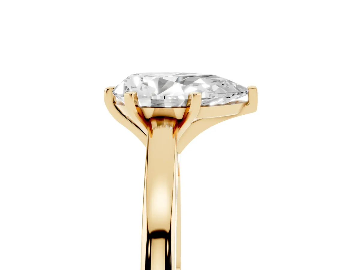 Pear Cut Solitaire Diamond Engagement Ring with Four-Prong Setting on a Classic Band Yellow gold