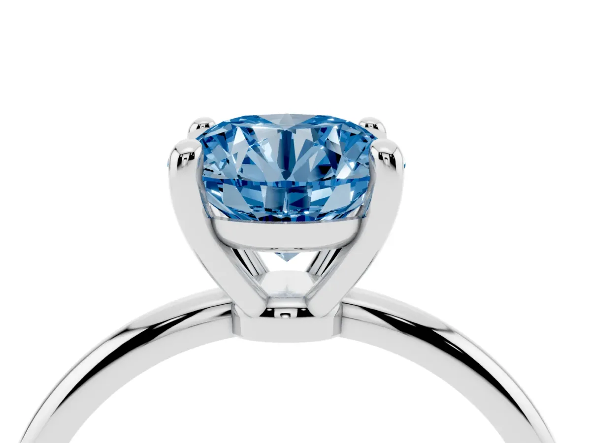 Fancy Blue Round Cut Solitaire Diamond Ring with 4-Prong Setting on a Classic Band Silver