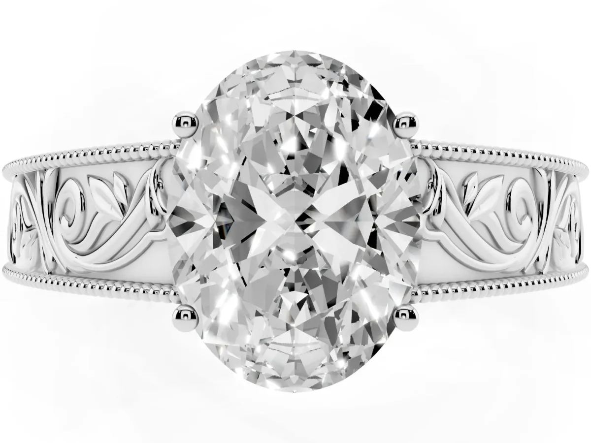 Oval Cut Diamond Solitaire Ring with Engraved Band and Four-Prong Setting Silver