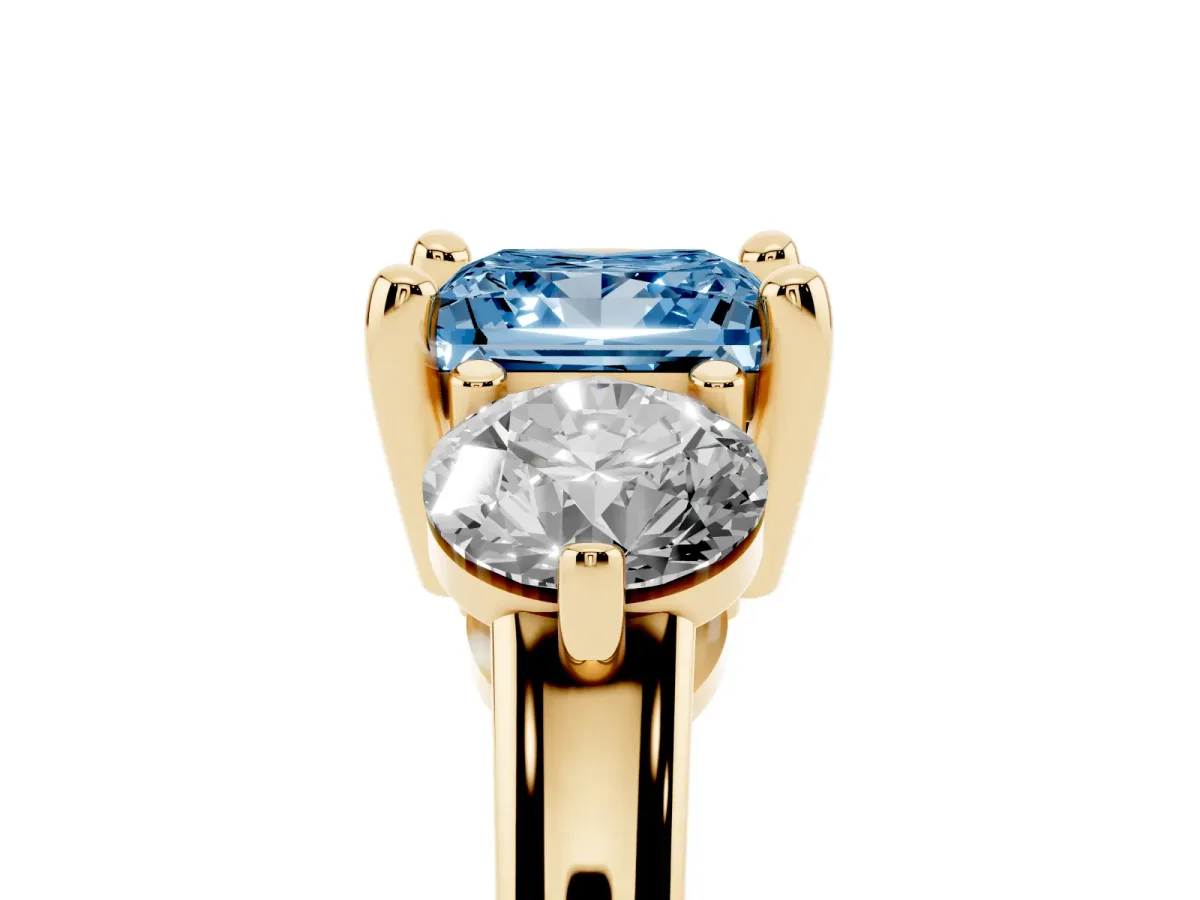 Fancy Blue Three-Stone Princess Cut Brilliant Cut Solitaire Ring with Prong Setting on a Classic Band Yellow gold
