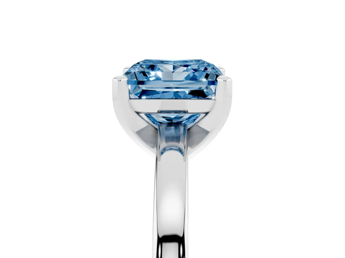 Fancy Blue Princess Cut Solitaire Diamond Engagement Ring with Four-Prong Setting on a Classic Band Silver