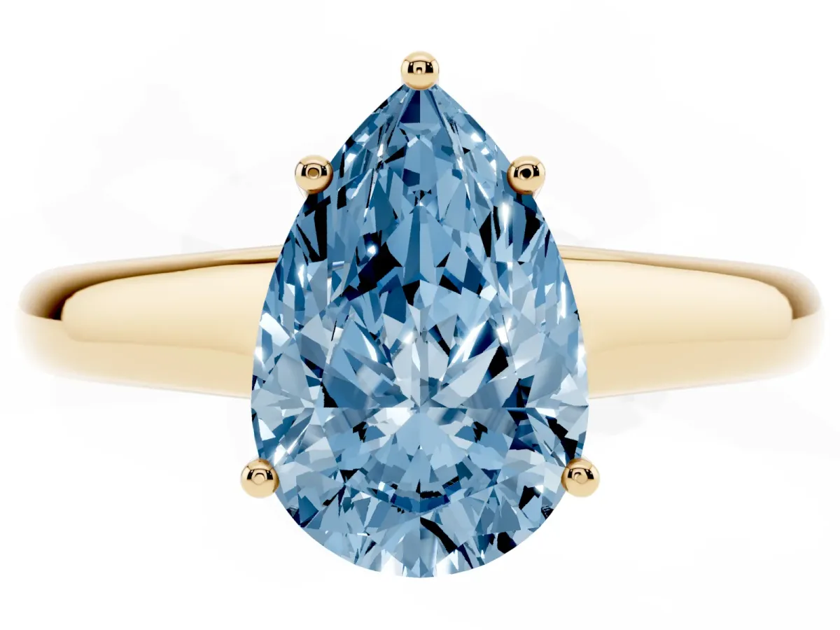 Fancy Blue Pear Cut Solitaire Engagement Ring with Tapered Band and Four-Prong Setting Yellow gold