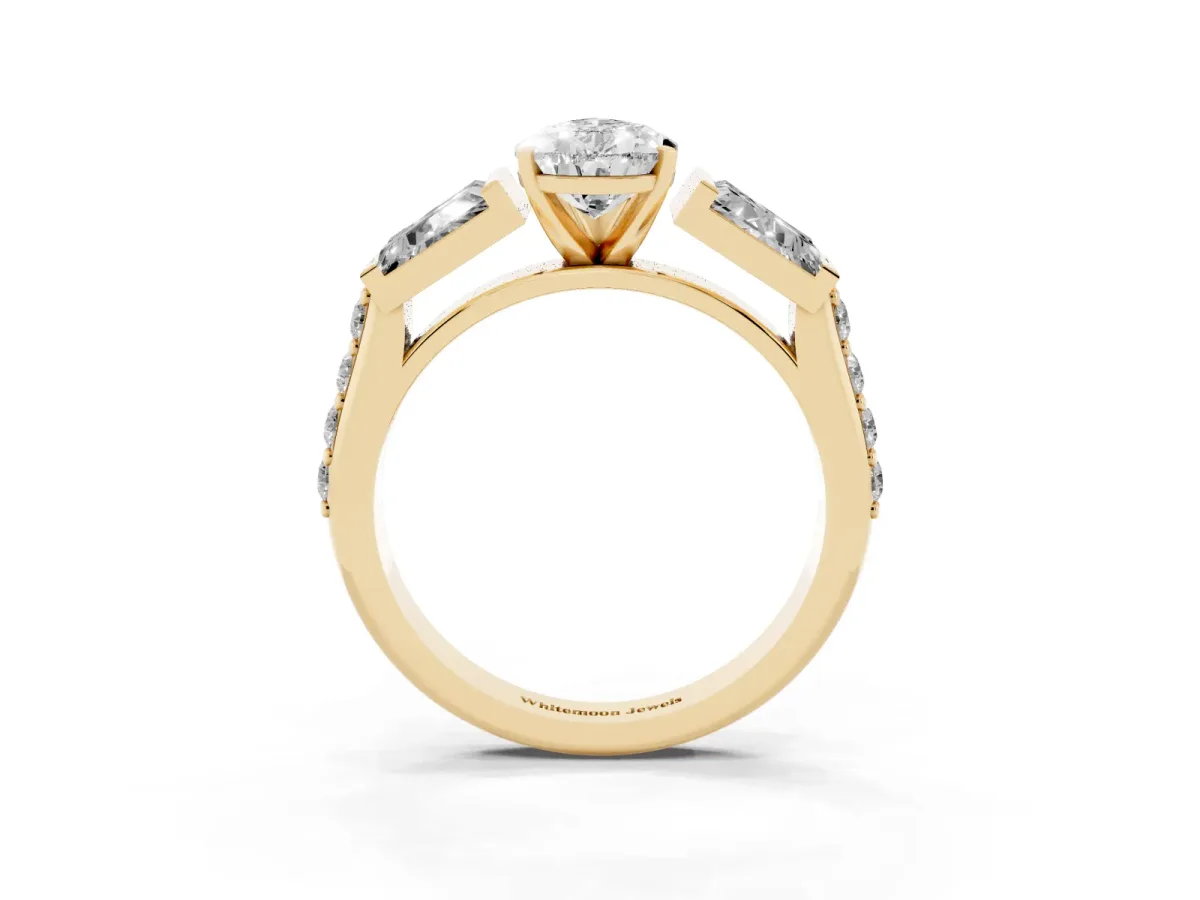 Pear Cut Diamond Engagement Ring with Baguette Side Stones and Channel Set Band Yellow gold