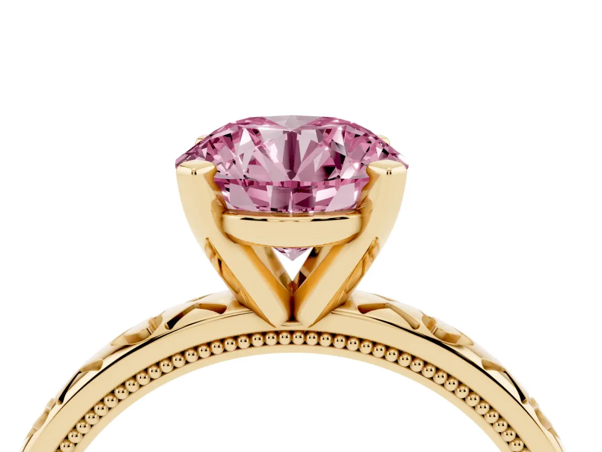 Fancy Pink Round Cut Solitaire Diamond Engagement Ring with XO Engraved Band and Four-Prong Setting Yellow gold