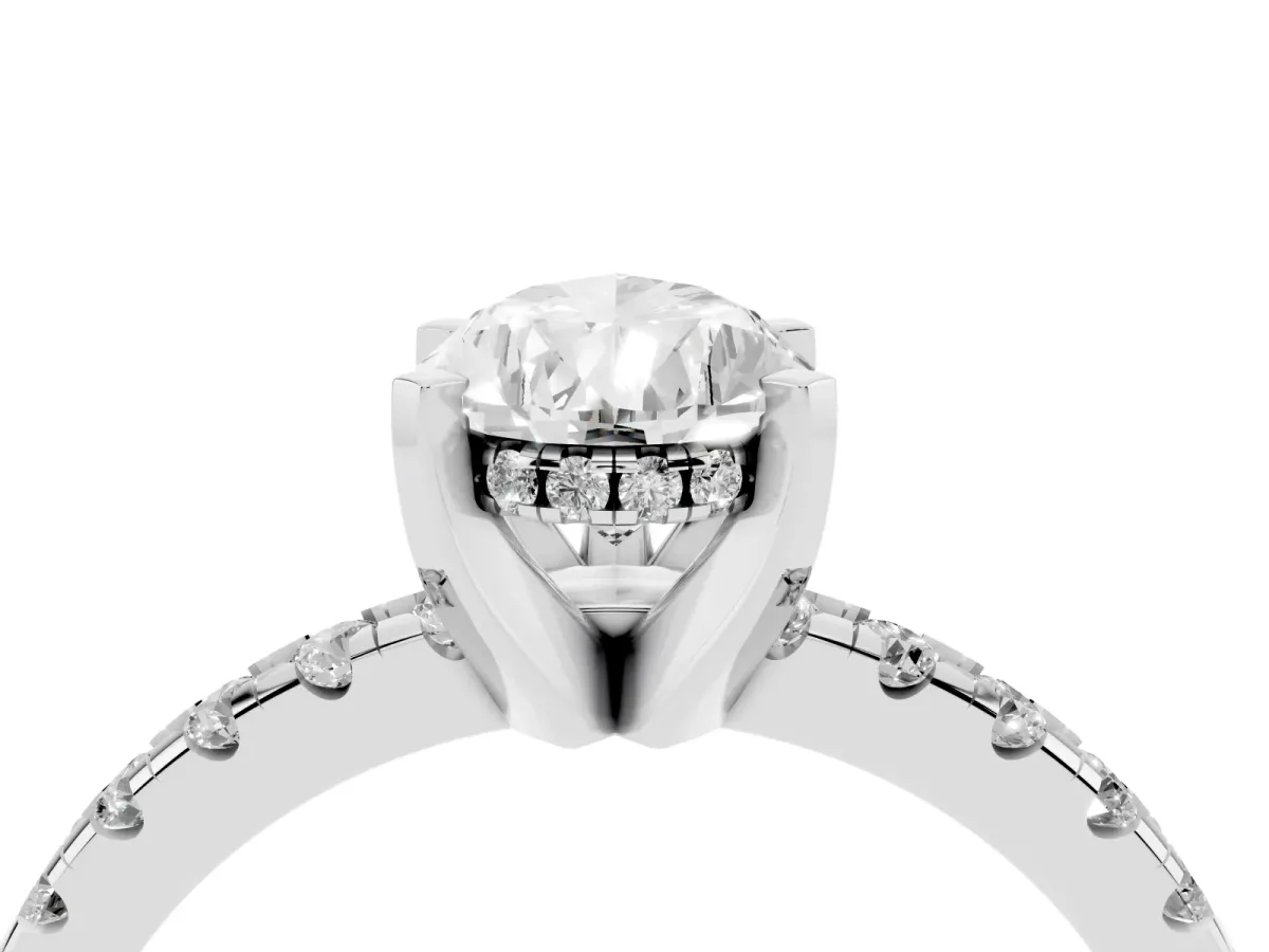 Pear Cut Diamond Solitaire Ring with Round Pavé Band and Four-Prong Setting Silver