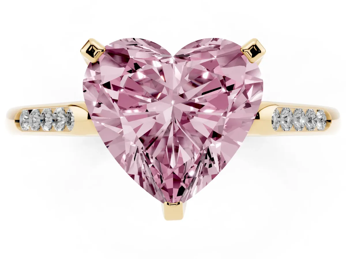 Fancy Pink Heart Cut Diamond Solitaire Ring with Channel Set Round Band and Prong Setting Yellow gold