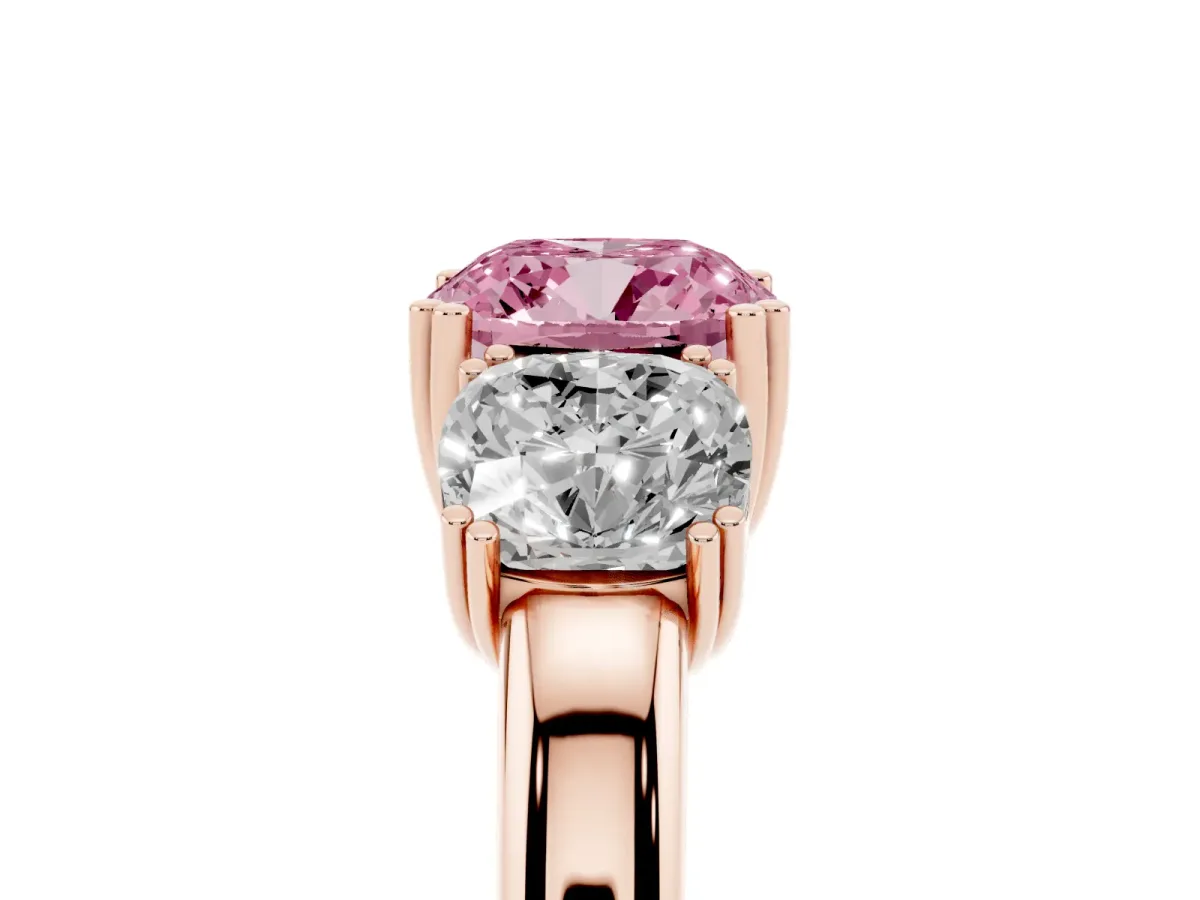 Fancy Pink Three-Stone Cushion Cut Cut Diamond Ring with Channel Set Band and Four-Prong Setting Rose gold