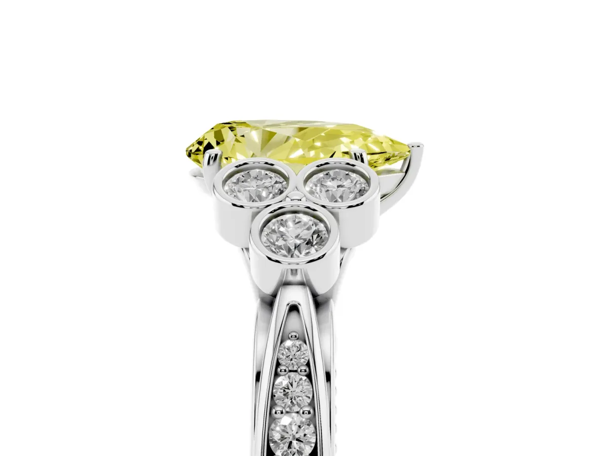 Fancy Yellow Pear Cut Cut Diamond Engagement Ring with Bezel Set Round Side Stones and Prong Setting Silver