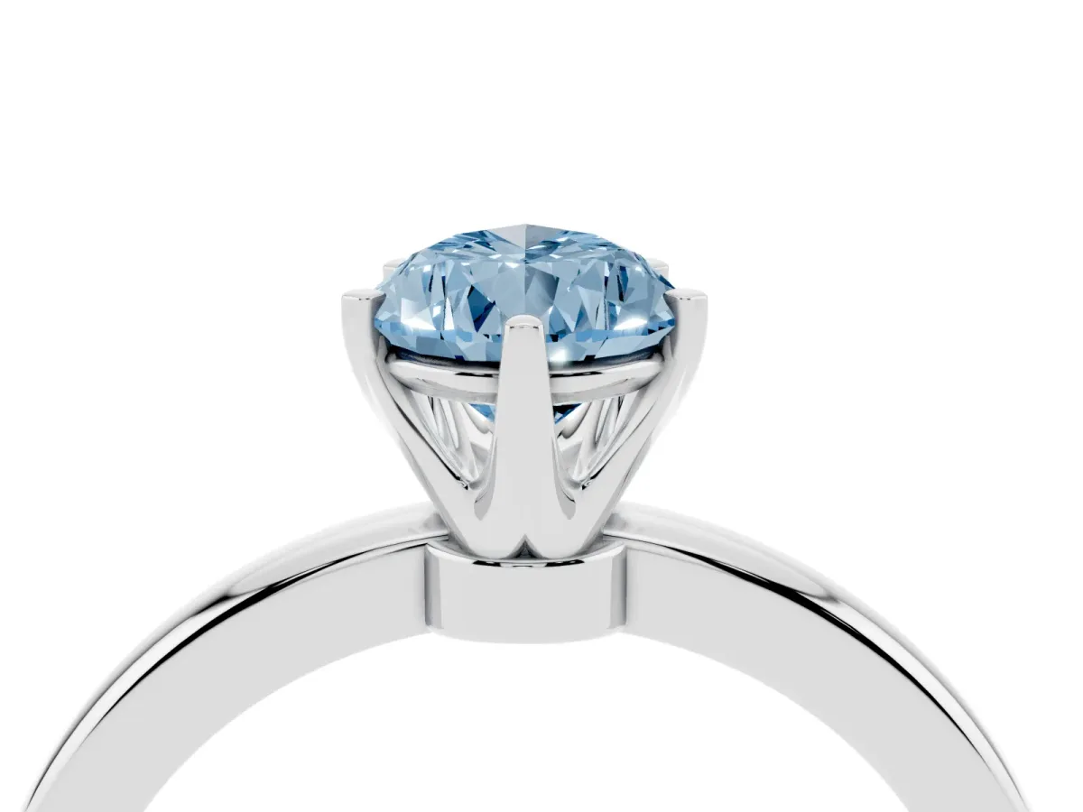 Fancy Blue Pear Cut Solitaire Diamond Ring with Six-Prong Setting on a Classic Band Platinum