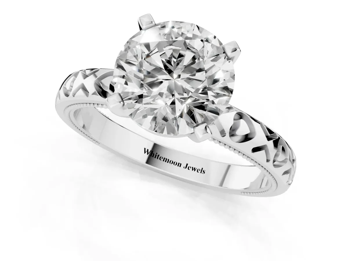 Round Cut Solitaire Diamond Engagement Ring with XO Engraved Band and Four-Prong Setting Silver