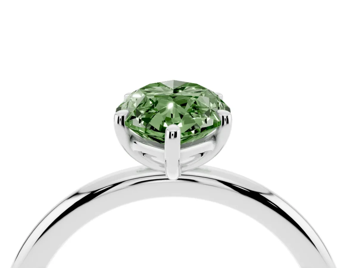 Fancy Green Oval Cut Solitaire Diamond Ring with Four-Prong Setting on a Plain Band Silver