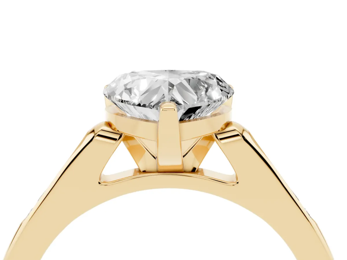 Heart Cut Diamond Solitaire Ring with Channel Set Round Band and Prong Setting Yellow gold