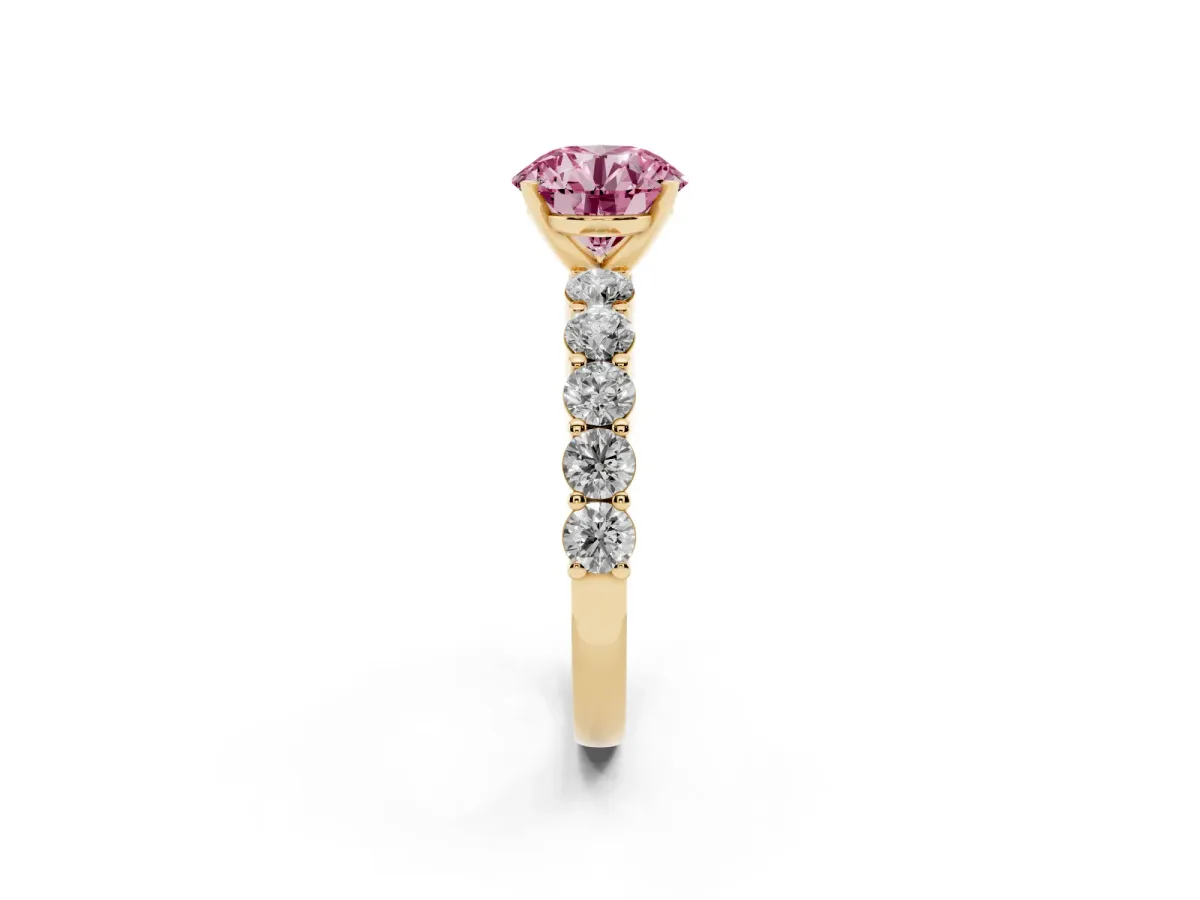 Fancy Pink Round Cut Diamond Solitaire Ring with Shared Prong Round Side Stones Yellow gold