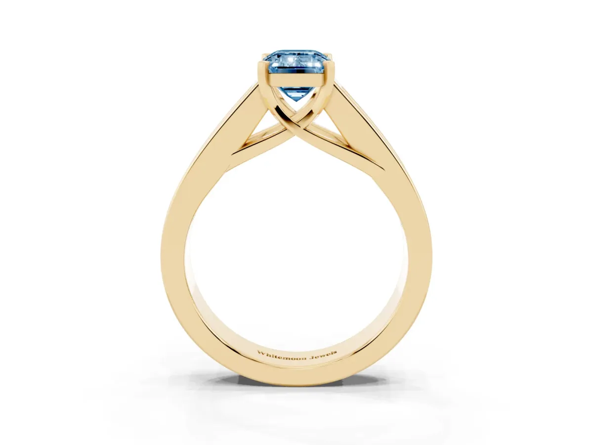 Fancy Blue Emerald Cut Cut Channel Set Solitaire Ring with Four-Prong Setting Yellow gold