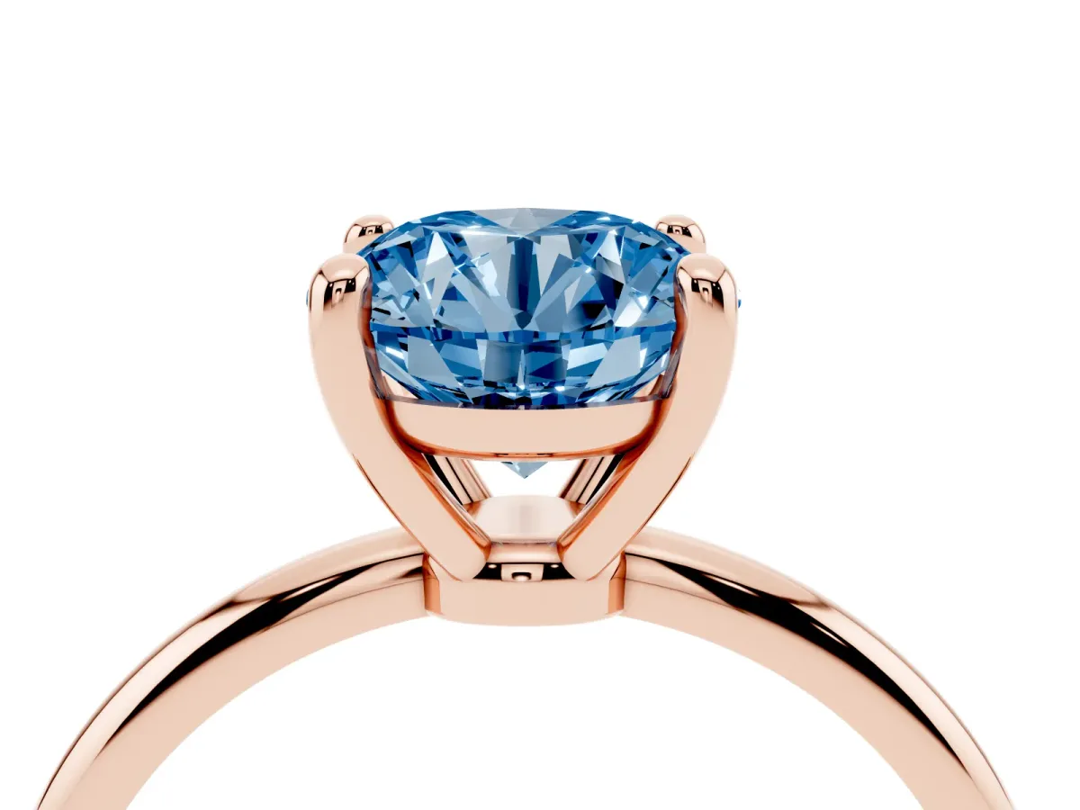Fancy Blue Round Cut Solitaire Diamond Ring with 4-Prong Setting on a Classic Band Rose gold