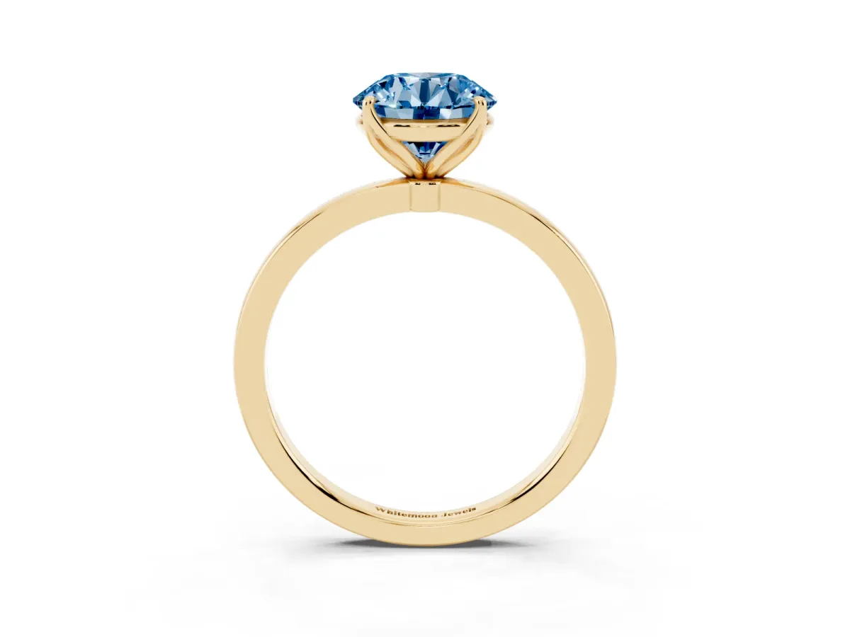 Fancy Blue Round Cut Diamond Solitaire Ring with Thin Band and Prong Setting Yellow gold