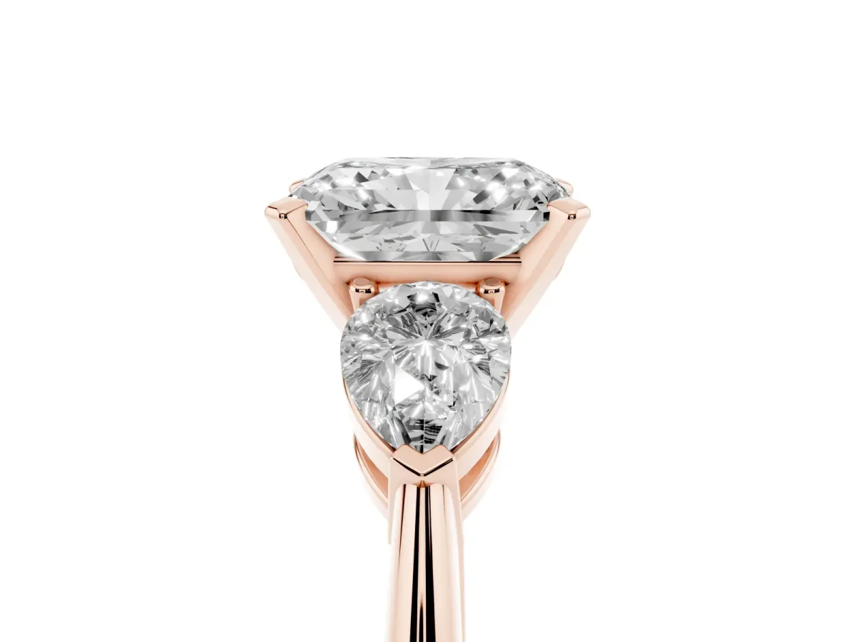Three-Stone Radiant Cut Diamond Ring with Pear Side Stones and Four-Prong Setting Rose gold