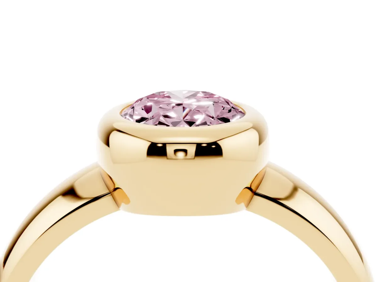 Fancy Pink Bezel Set Oval Cut Solitaire Ring with Wide Band Yellow gold