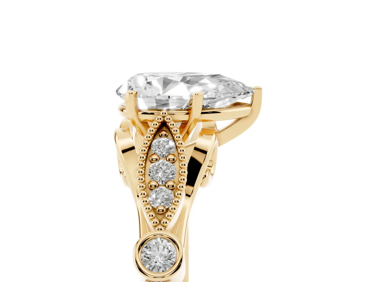 Pear Cut Cut Diamond with Milgrain Marquise and Bezel Accents on a Solitaire Band with Prong Setting Yellow gold