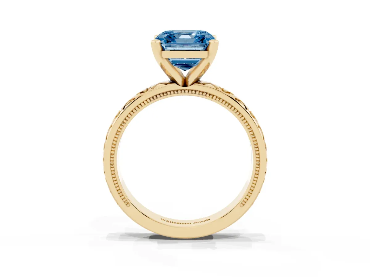 Fancy Blue Asscher Cut Solitaire Diamond Engagement Ring with XO Engraved Band and Four-Prong Setting Yellow gold