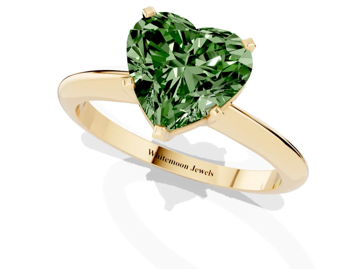 Fancy Green Heart Cut Cut Solitaire Ring with Four-Prong Setting on a Classic Band Yellow gold