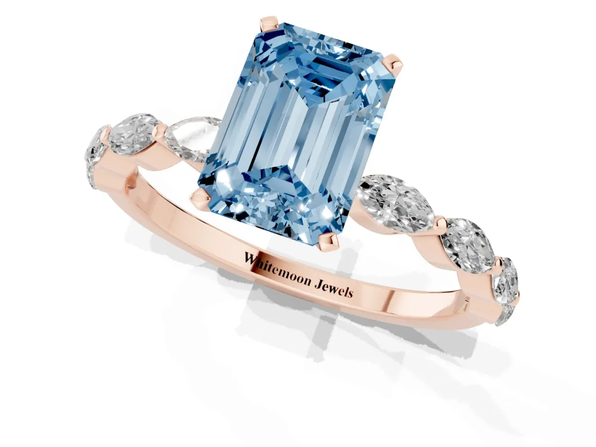 Fancy Blue Emerald Cut Diamond Ring with Marquise Side Stones and Prong Setting Rose gold