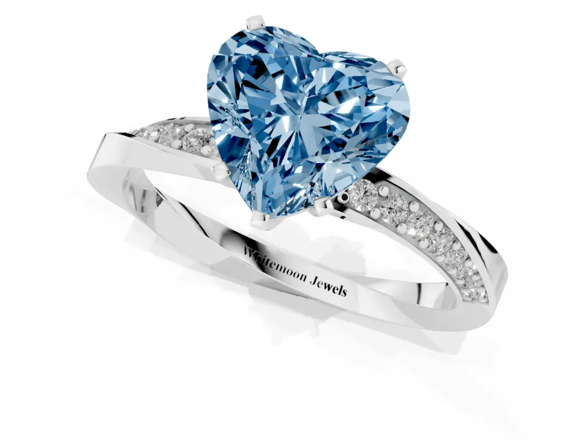 Fancy Blue Heart Cut Diamond Engagement Ring with Side Stone Accents and Four-Prong Setting Silver
