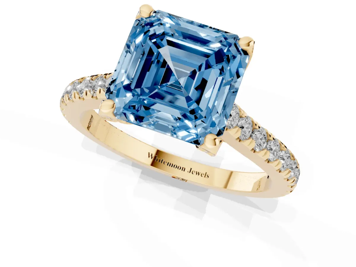 Fancy Blue Asscher Cut Brilliant Diamond Solitaire with Pavé Band and Four-Prong Setting Yellow gold