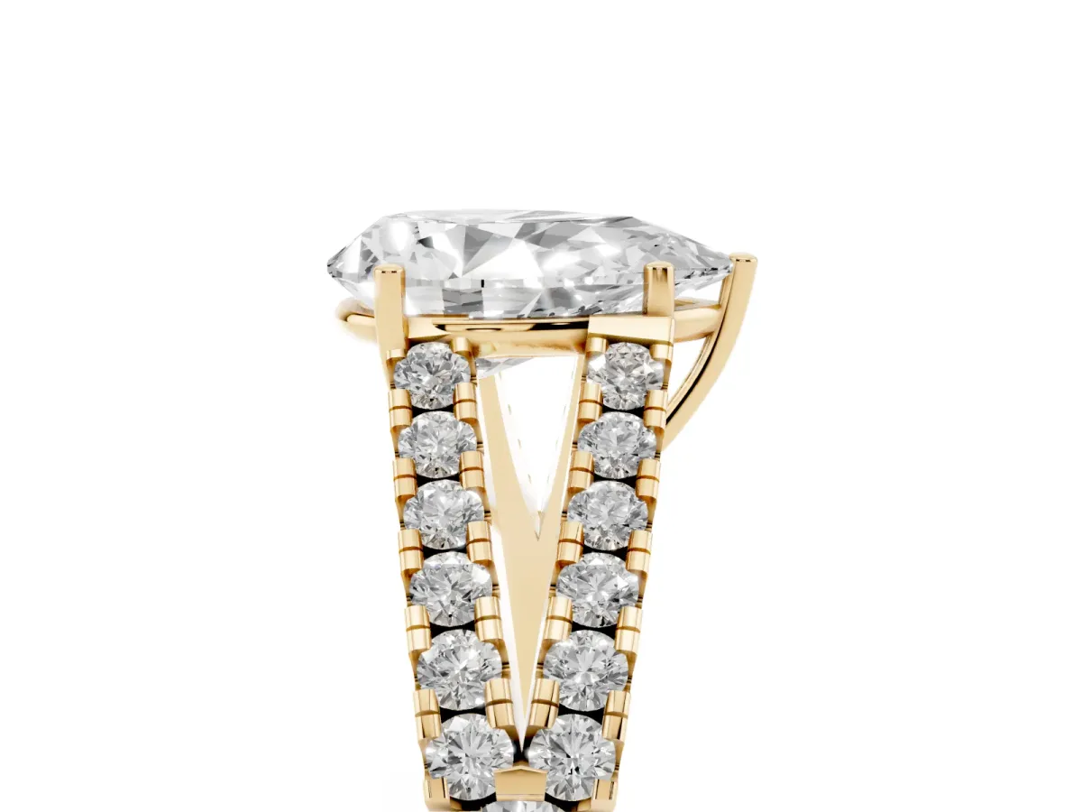 Pear Cut Diamond Split Shank Engagement Ring with Round Pavé and Prong Setting Yellow gold