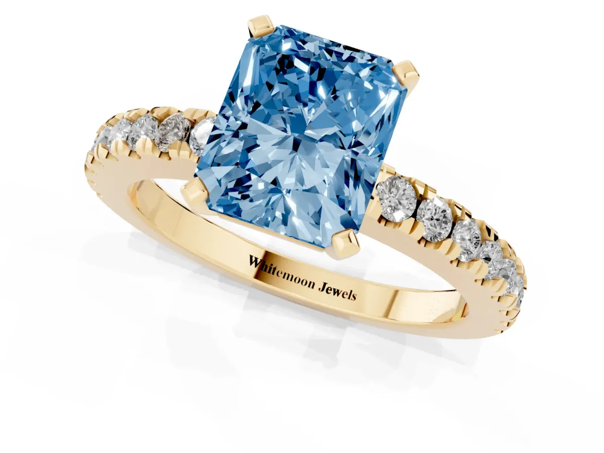 Fancy Blue Radiant Cut Solitaire Diamond with Pavé Band and Four-Prong Setting Yellow gold