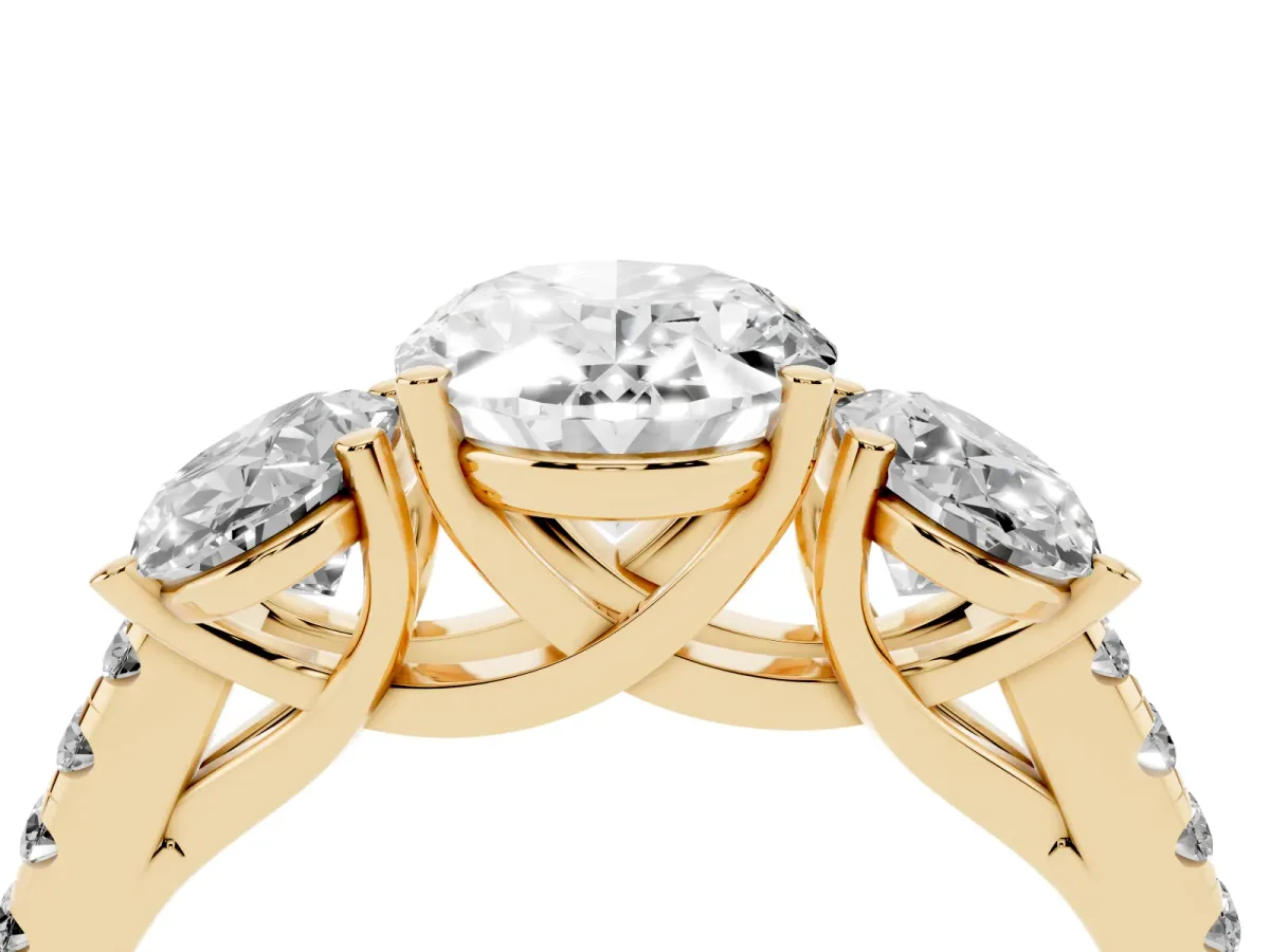 Three-Stone Oval Cut Diamond Ring with Round Pavé Band and Prong Setting Yellow gold