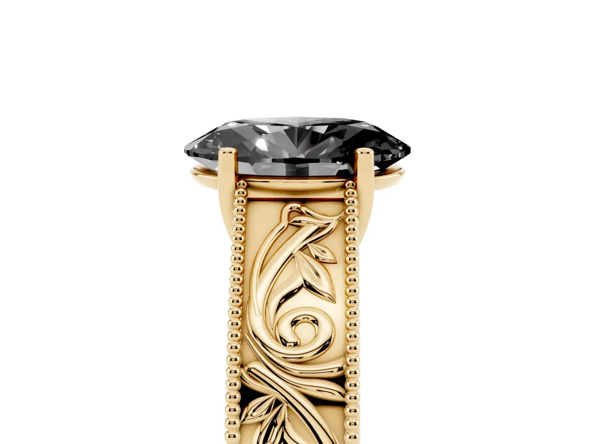 Fancy Black Oval Cut Diamond Solitaire Ring with Engraved Band and Four-Prong Setting Yellow gold