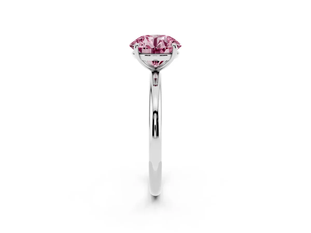 Fancy Pink Round Cut Solitaire Diamond Ring with Four-Prong Setting on a Plain Band Platinum