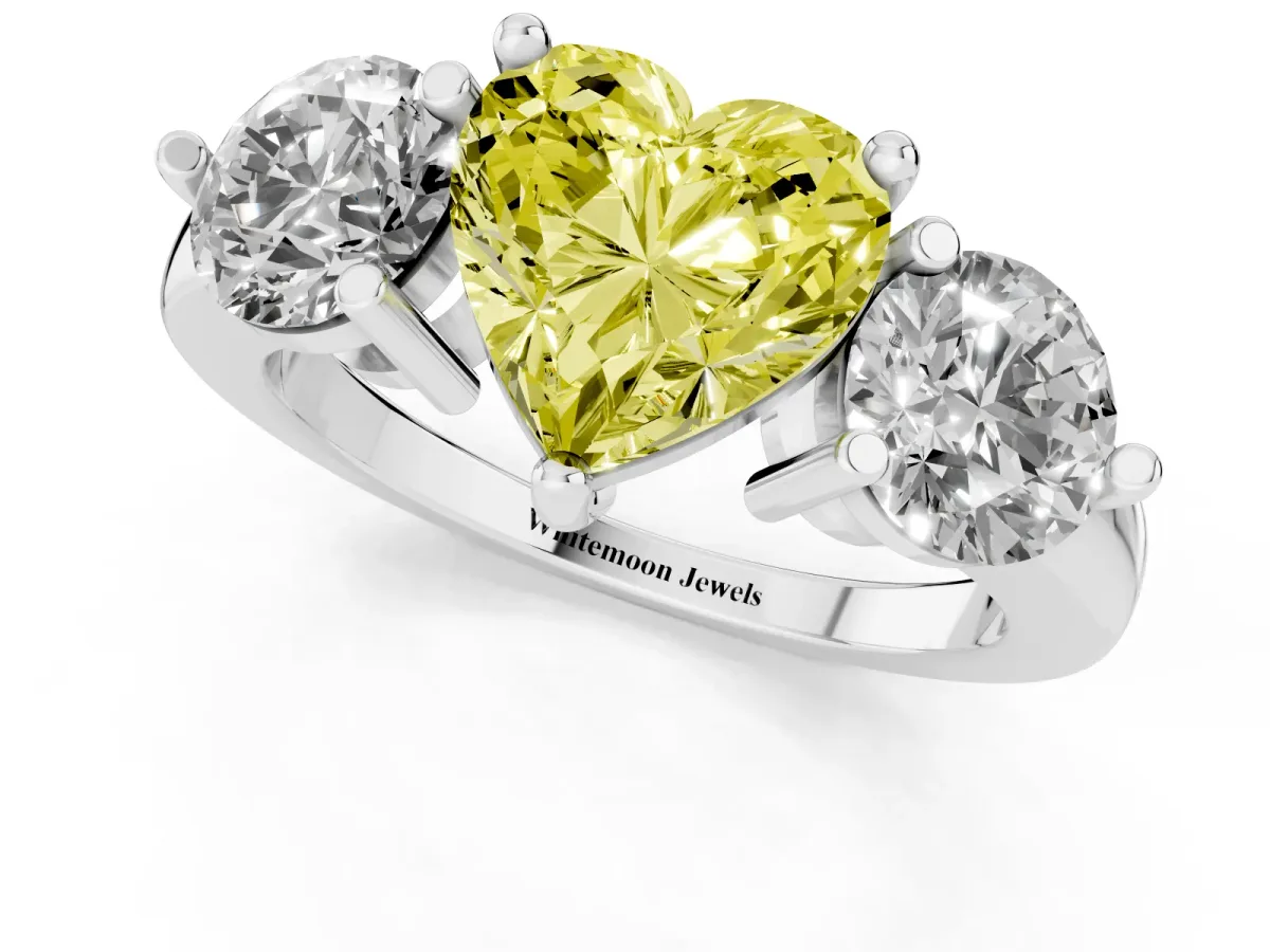 Fancy Yellow Three-Stone Heart Cut Brilliant Cut Solitaire Ring with Prong Setting on a Classic Band Silver