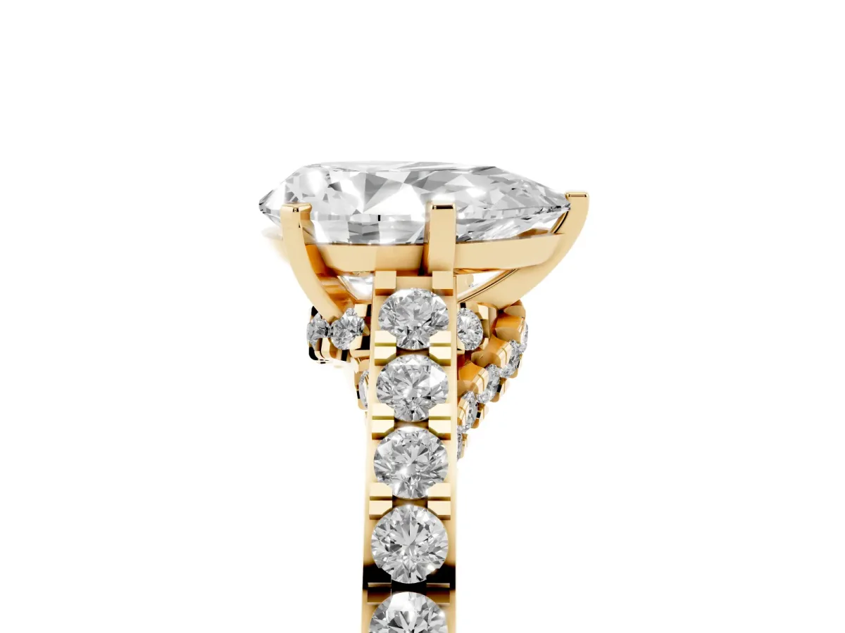Pear Cut Diamond Solitaire Ring with Crossover Gallery and Round Pavé Band Yellow gold